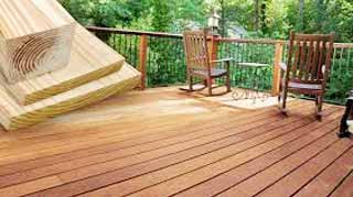 when is pressure-treated lumber ready to be painted or stained